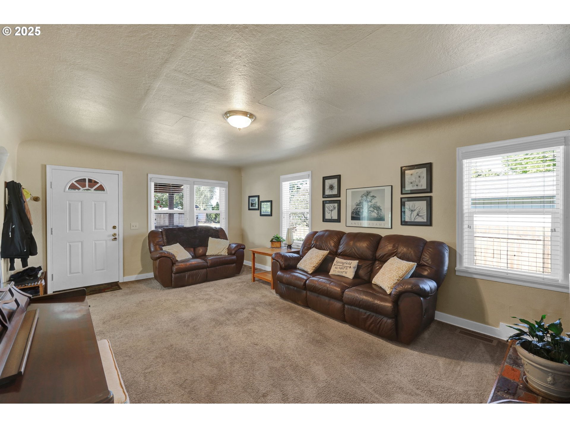 1441 6th Street Springfield, OR 97477 - Photo 6 of 48 a living room with furniture window and a flat screen tv