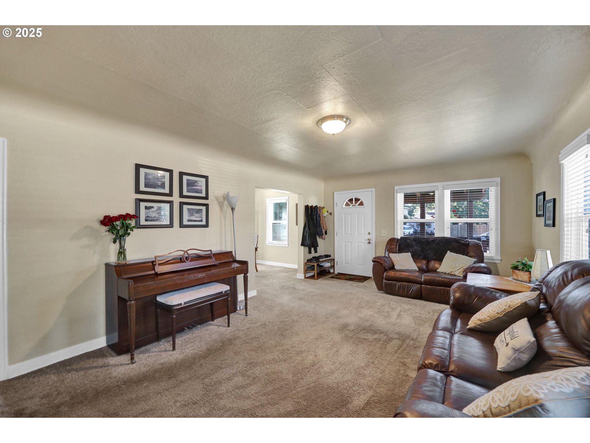 1441 6th Street Springfield, OR 97477 - Photo 8 of 48 a living room with furniture a piano and a window