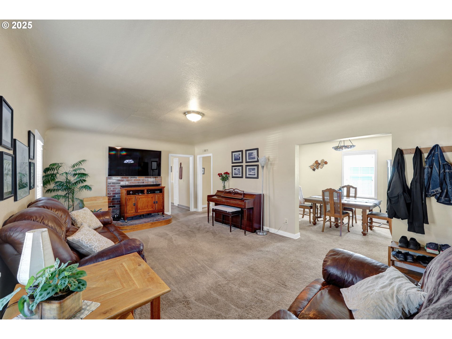 1441 6th Street Springfield, OR 97477 - Photo 10 of 48 a living room with furniture and a flat screen tv