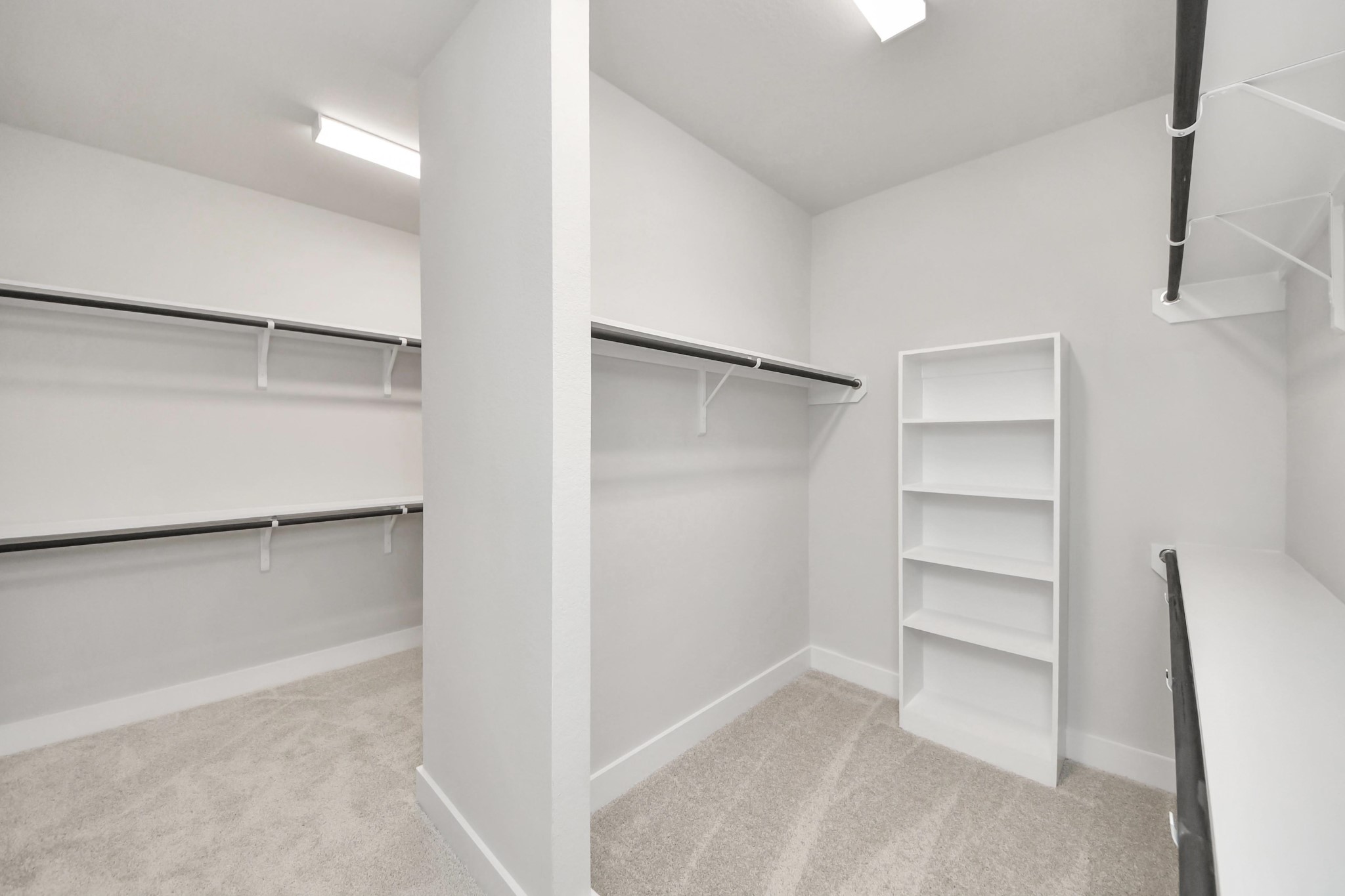 3042 Native Spg Drive Spring, TX 77373 - Photo 30 of 32 Walk-in closet that epitomizes luxury and practicality. This generously sized space features built-in shelving, offering abundant room for impeccable organization. High ceilings and recessed lighting create a bright and welcoming ambiance. Sample photo of completed home with similar floor plan. Actual colors and selections may vary.