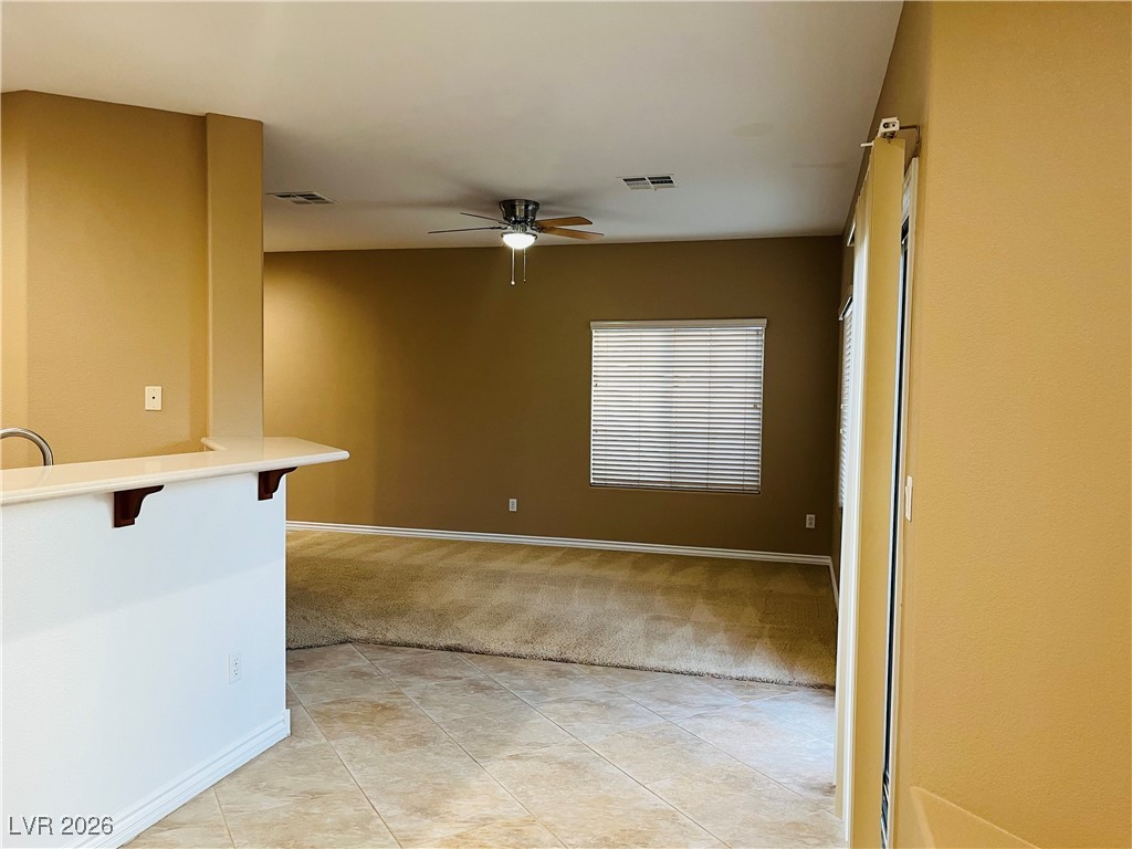 259 Integrity Ridge Drive Henderson, NV 89052 - Photo 14 of 50 Kitchen w/breakfast bar w/corian counters, cherry cabinets, SS appliances, tile floors, new sink & faucet, dining nook & pantry.