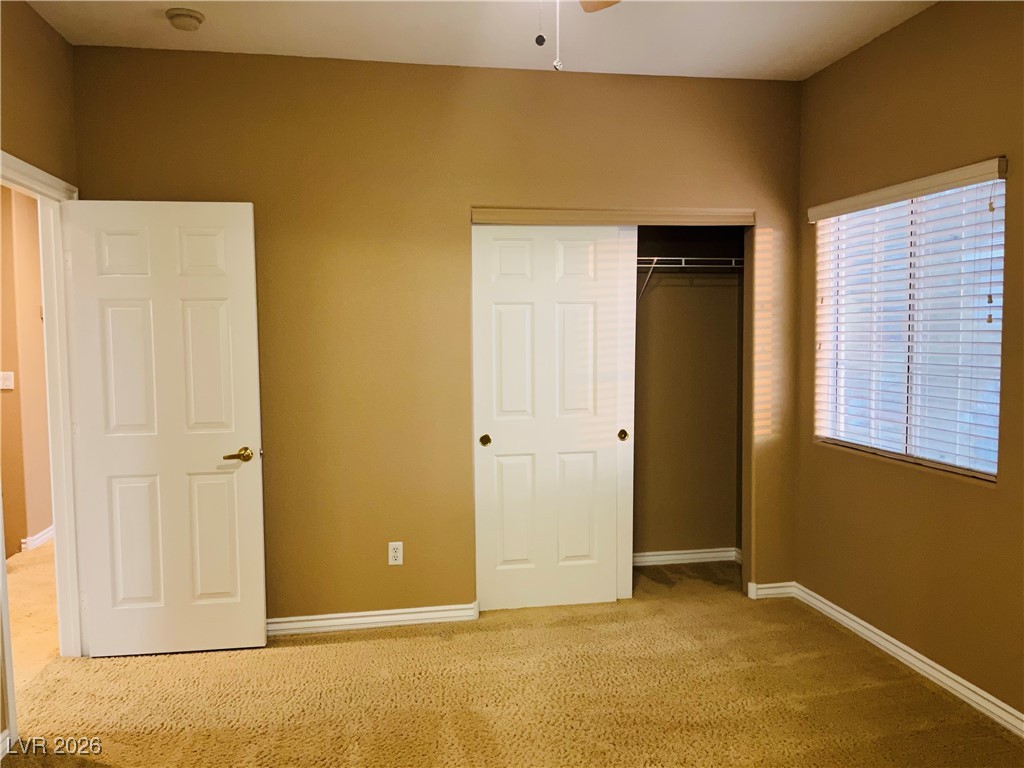 259 Integrity Ridge Drive Henderson, NV 89052 - Photo 35 of 50 Bed 3 w/ceiling fan & light, carpet that share jack-n-jill bath w/dual sinks, cherry cabinets, corian counters w/new faucets w/tub & shower combo.