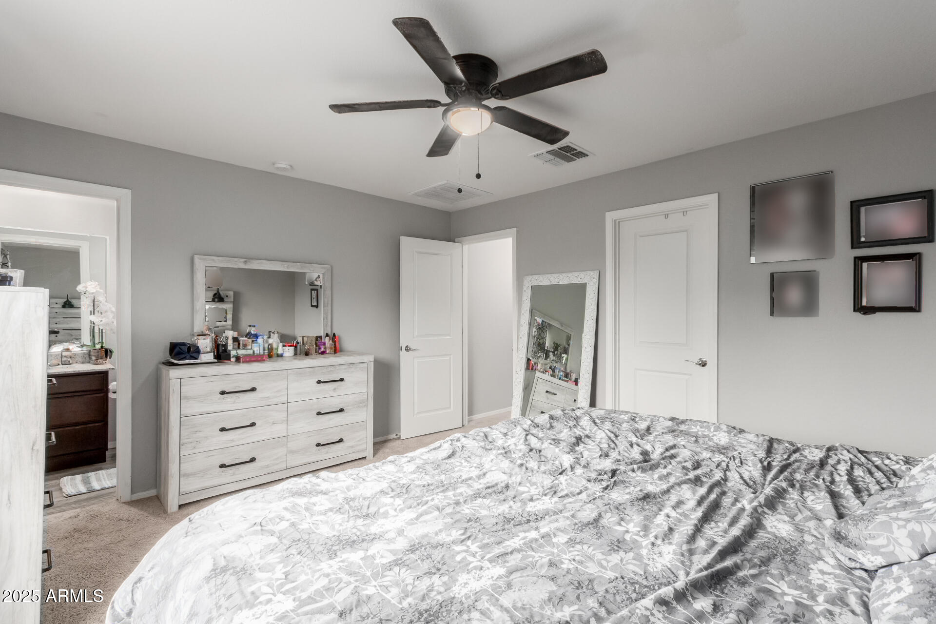 685 West 16th Street Florence, AZ 85132 - Photo 13 of 26 a bed room with a bed and a dresser