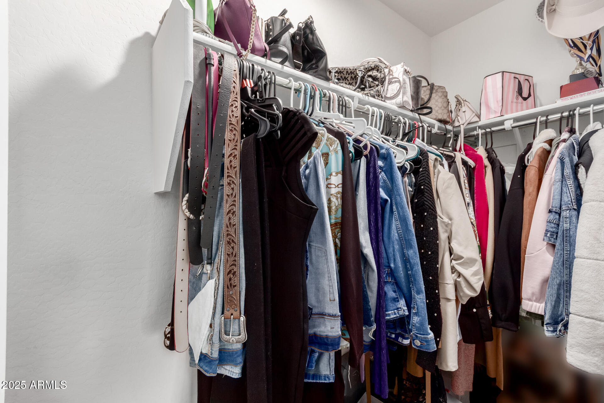 685 West 16th Street Florence, AZ 85132 - Photo 15 of 26 a view of walk in closet with clothes