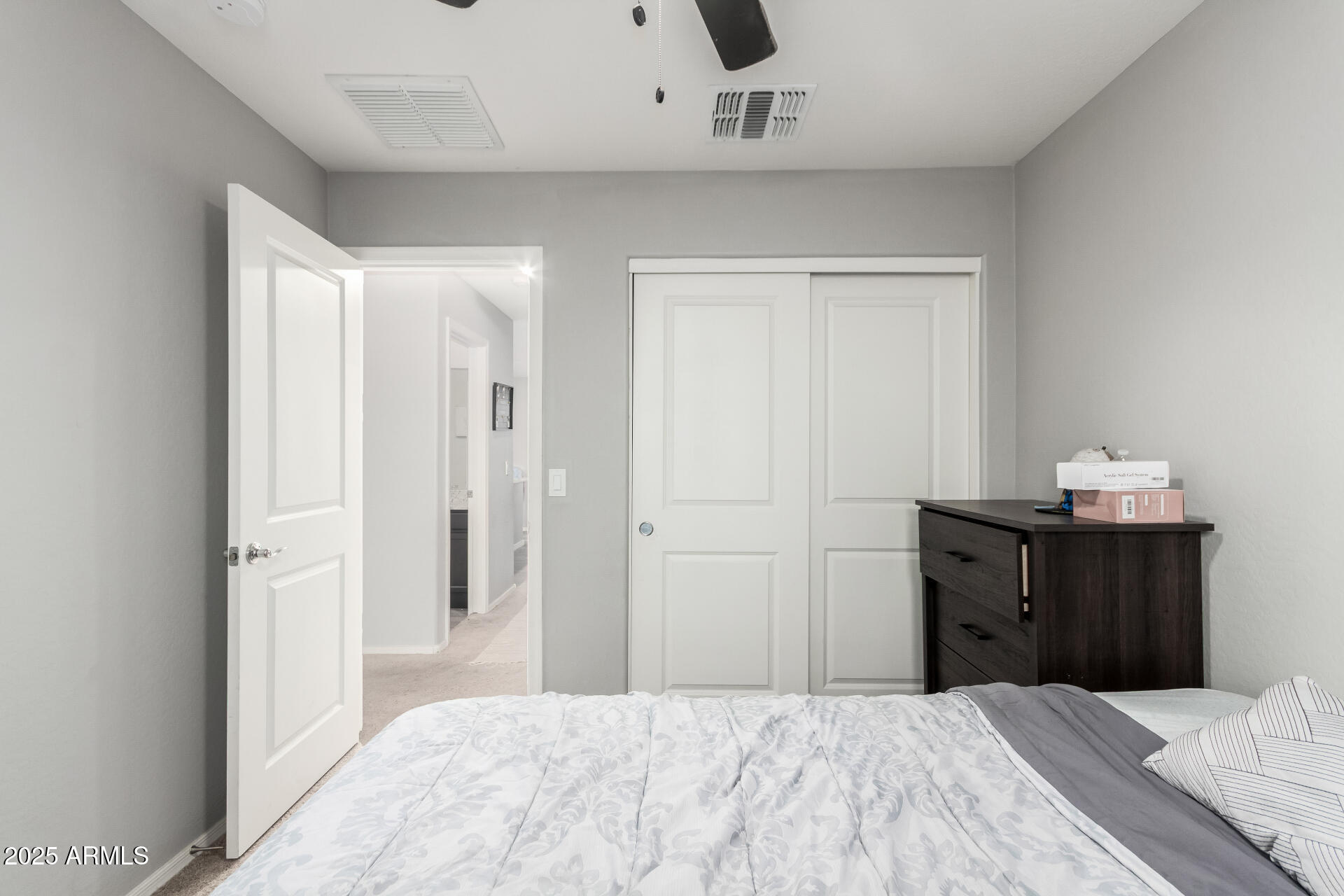685 West 16th Street Florence, AZ 85132 - Photo 17 of 26 a bedroom with a bed and wooden floor