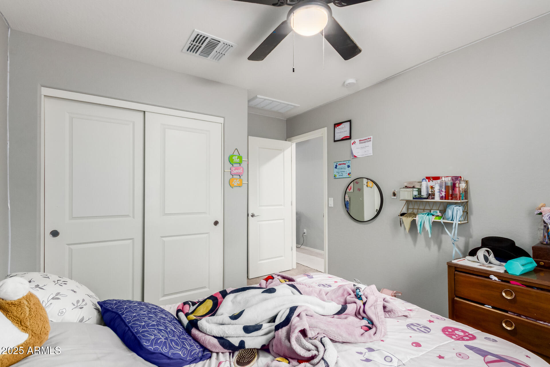 685 West 16th Street Florence, AZ 85132 - Photo 19 of 26 a bedroom with a bed and chandelier