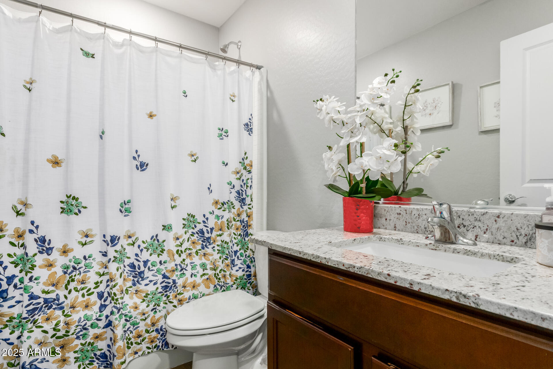 685 West 16th Street Florence, AZ 85132 - Photo 20 of 26 a bathroom with a granite countertop sink a toilet and a shower