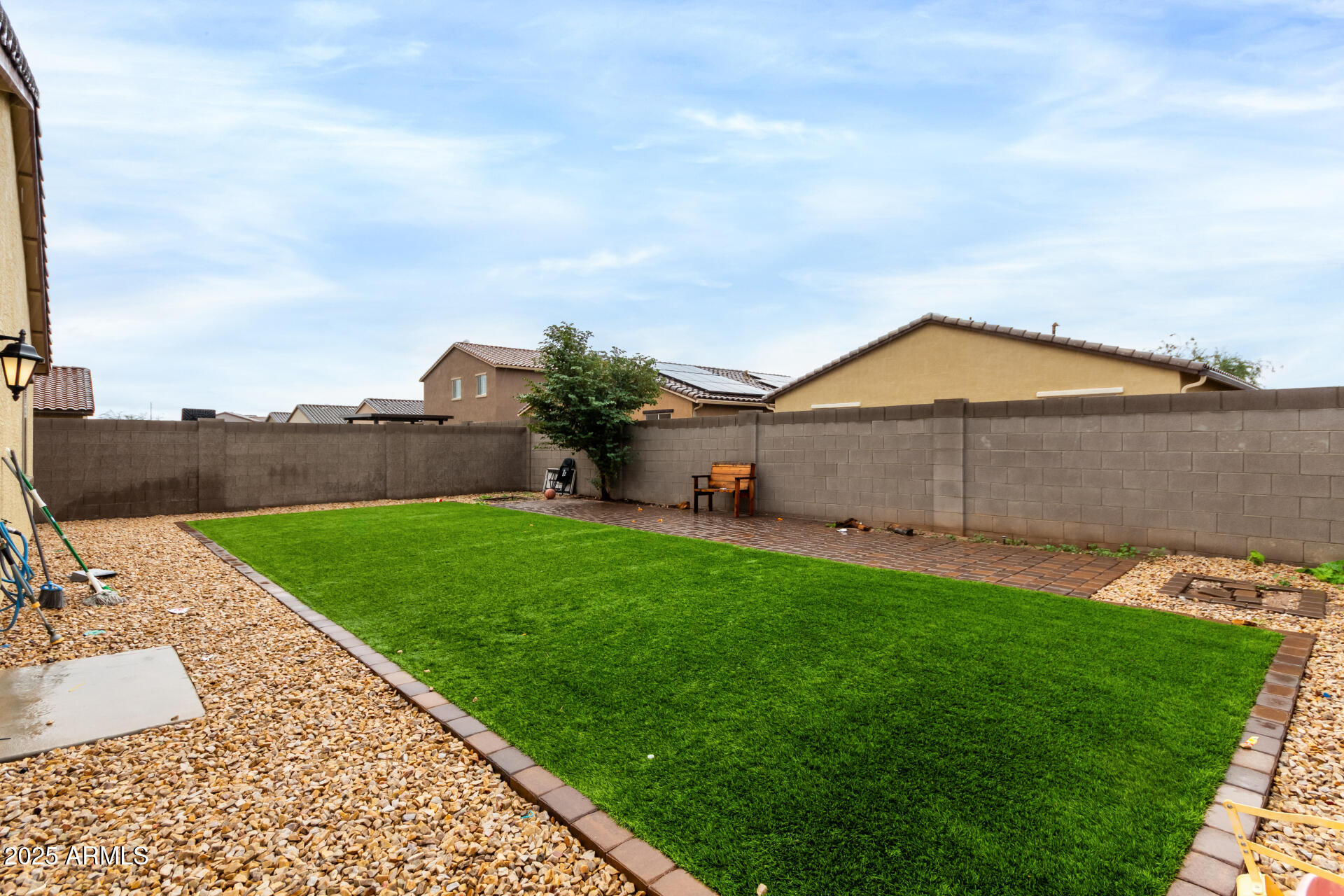 685 West 16th Street Florence, AZ 85132 - Photo 26 of 26 a backyard of a house with lots of green space and lake view