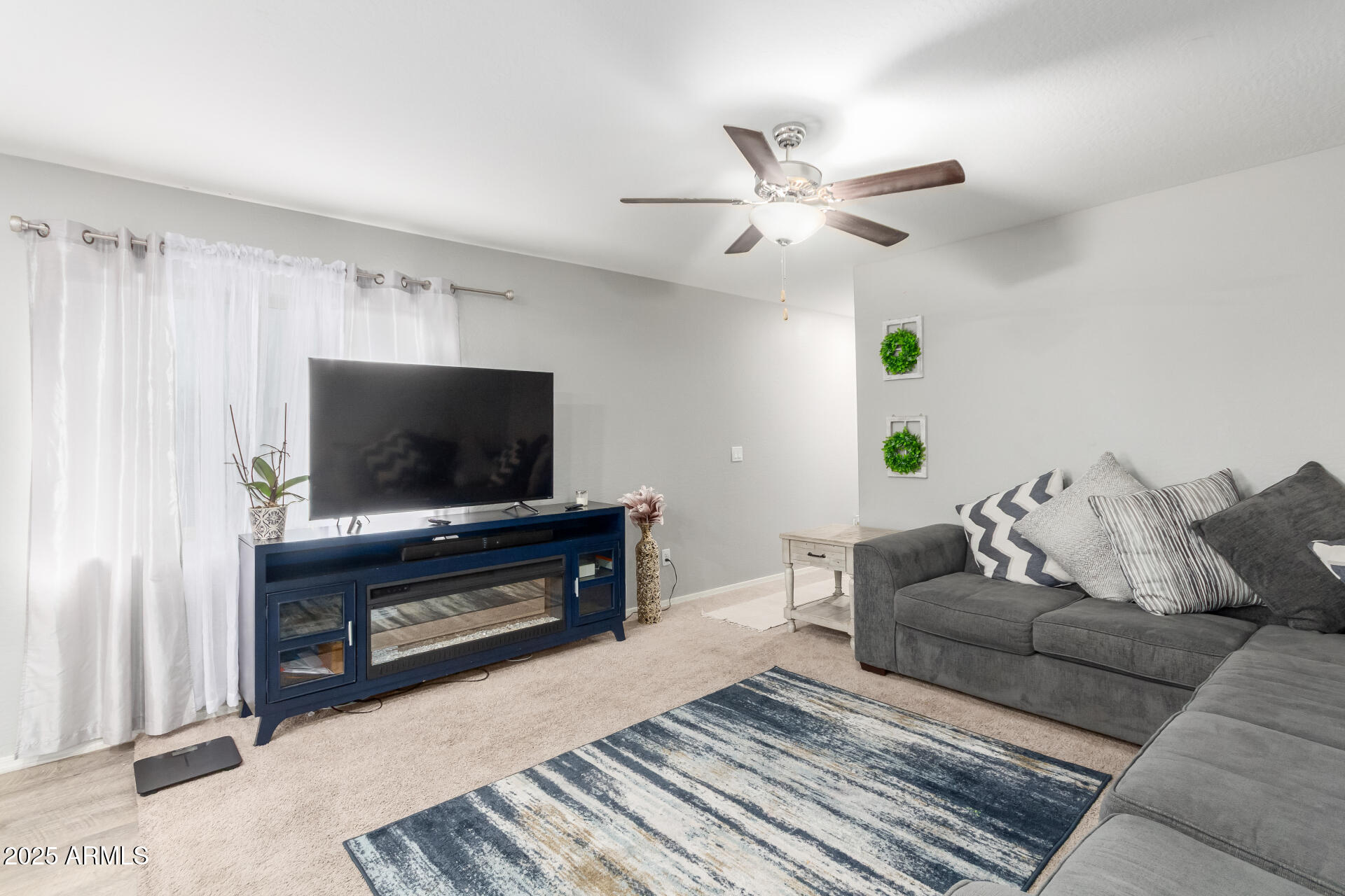 685 West 16th Street Florence, AZ 85132 - Photo 6 of 26 a living room with furniture and a flat screen tv