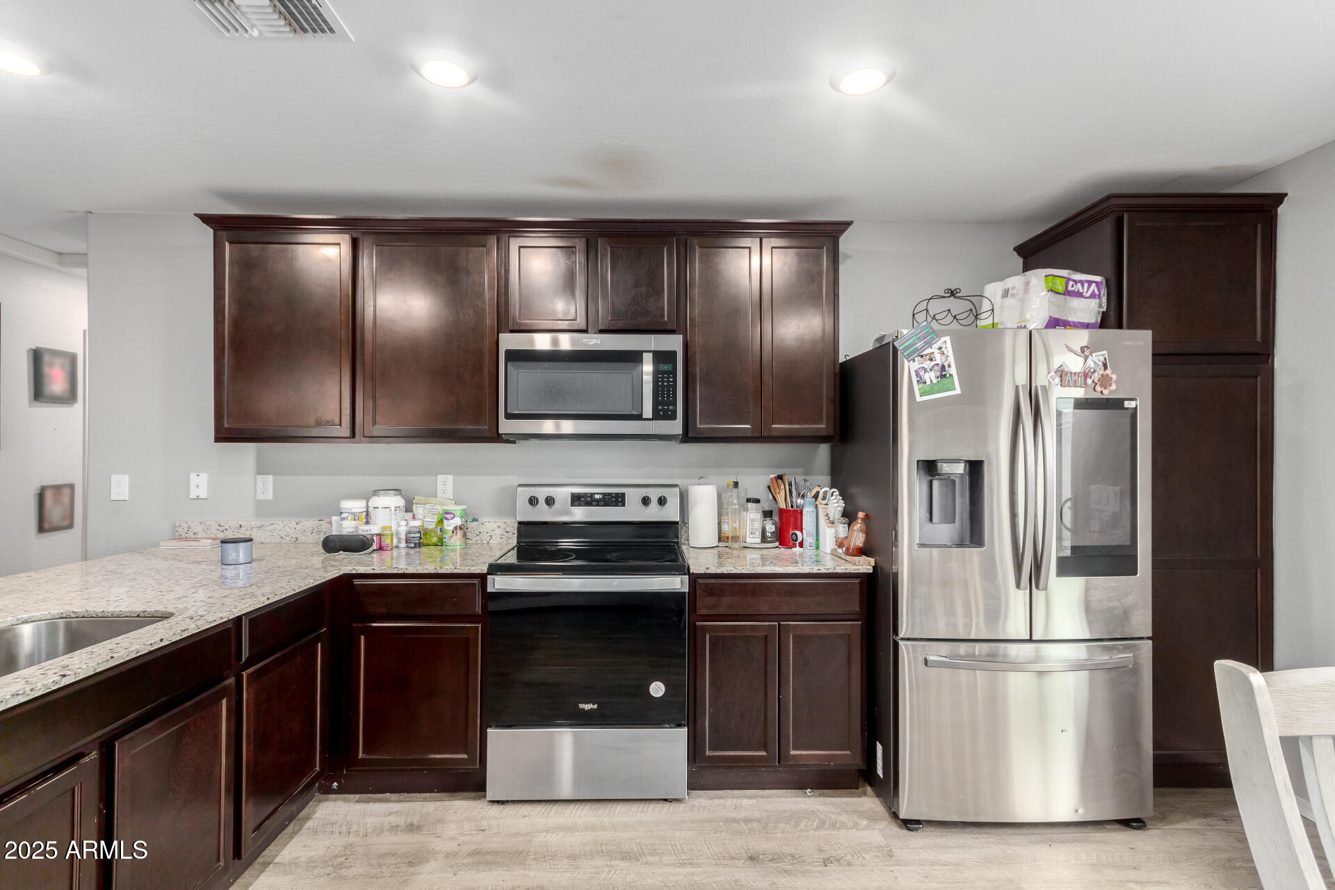 685 West 16th Street Florence, AZ 85132 - Photo 8 of 26 a kitchen with a refrigerator and a sink
