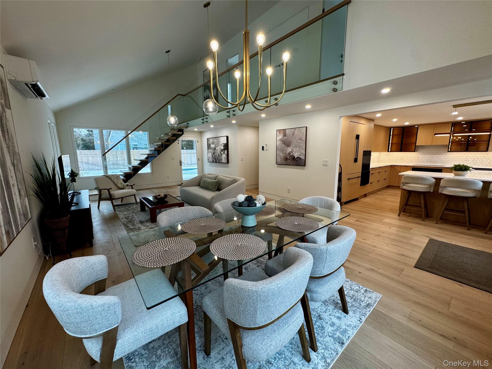 17 Heather Drive Remsenburg, NY 11960 - Photo 11 of 37 a living room with lots of furniture and kitchen view