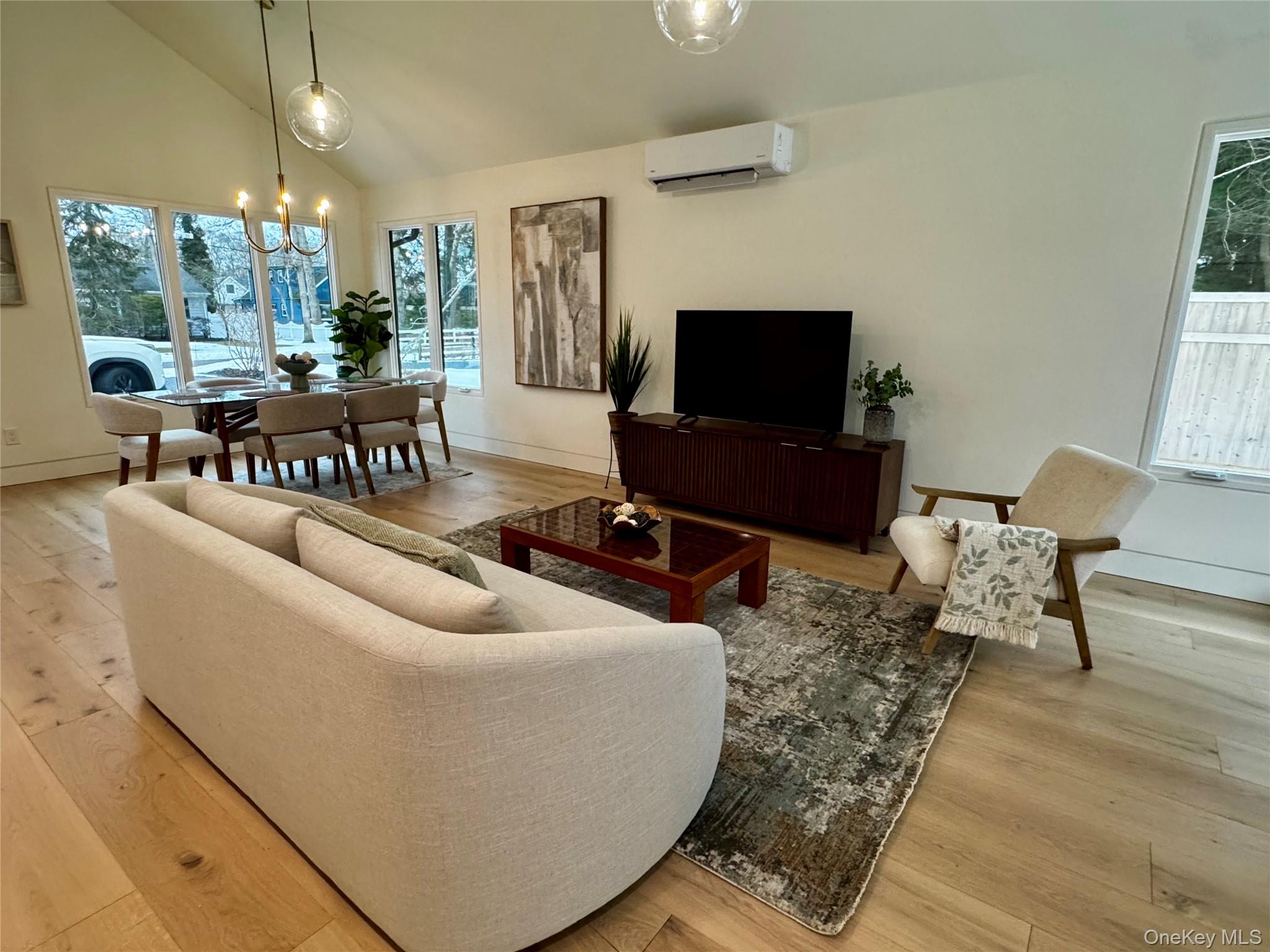 17 Heather Drive Remsenburg, NY 11960 - Photo 14 of 37 a living room with furniture and a flat screen tv