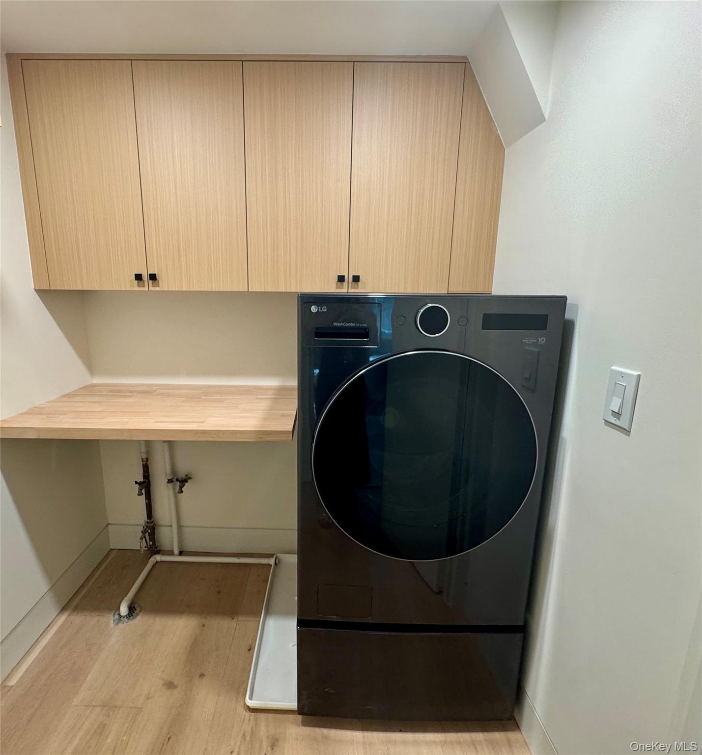 17 Heather Drive Remsenburg, NY 11960 - Photo 22 of 37 a washer and dryer sitting in a kitchen