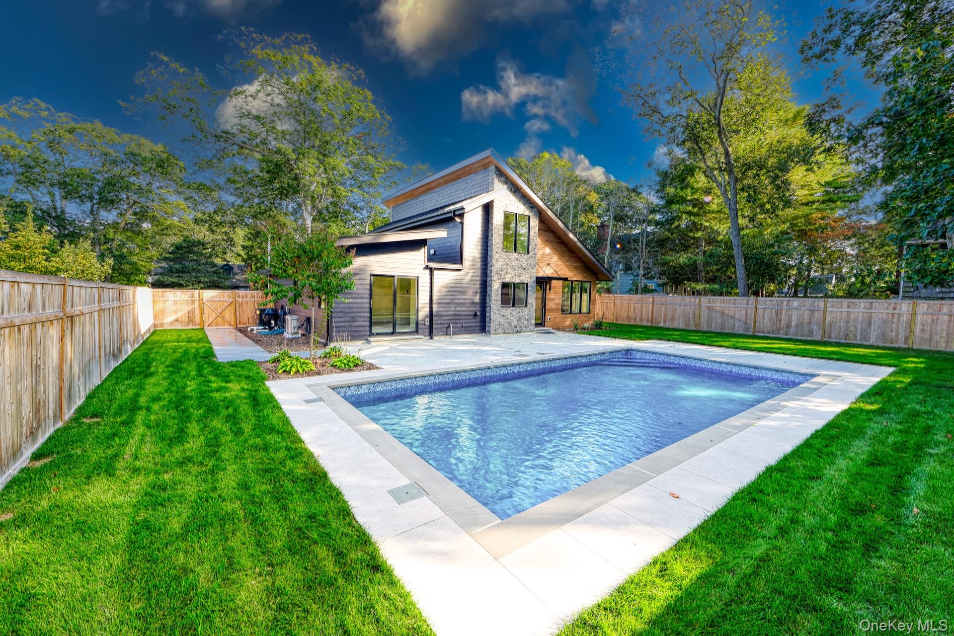 17 Heather Drive Remsenburg, NY 11960 - Photo 29 of 37 a view of outdoor space yard and swimming pool