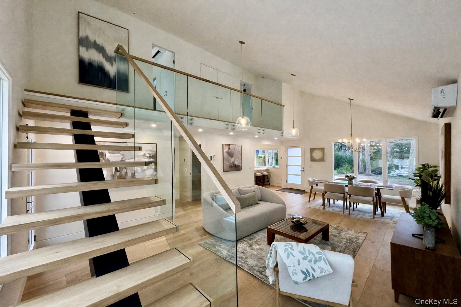 17 Heather Drive Remsenburg, NY 11960 - Photo 36 of 37 a living room with furniture and a floor to ceiling window
