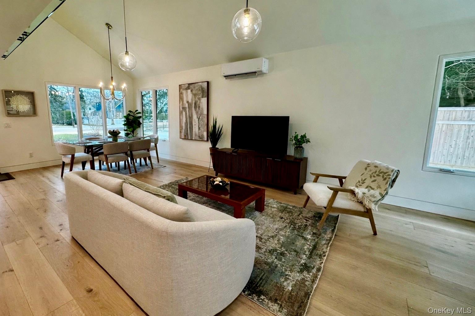 17 Heather Drive Remsenburg, NY 11960 - Photo 37 of 37 a living room with furniture and a flat screen tv