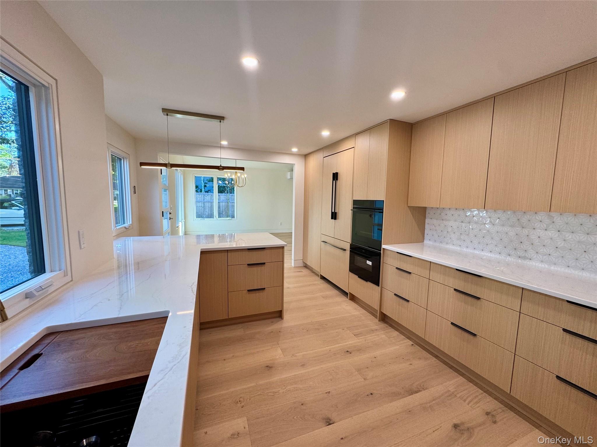 17 Heather Drive Remsenburg, NY 11960 - Photo 6 of 37 a view of a kitchen with cabinets