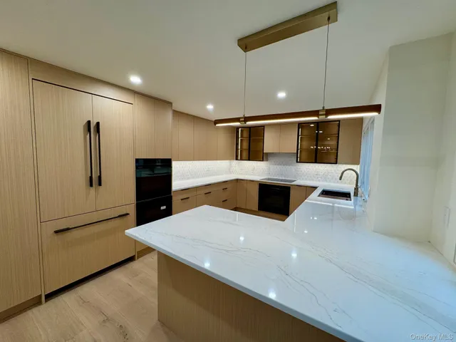 a view of a kitchen with cabinets