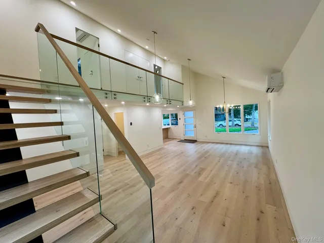 a view of a room with wooden floor