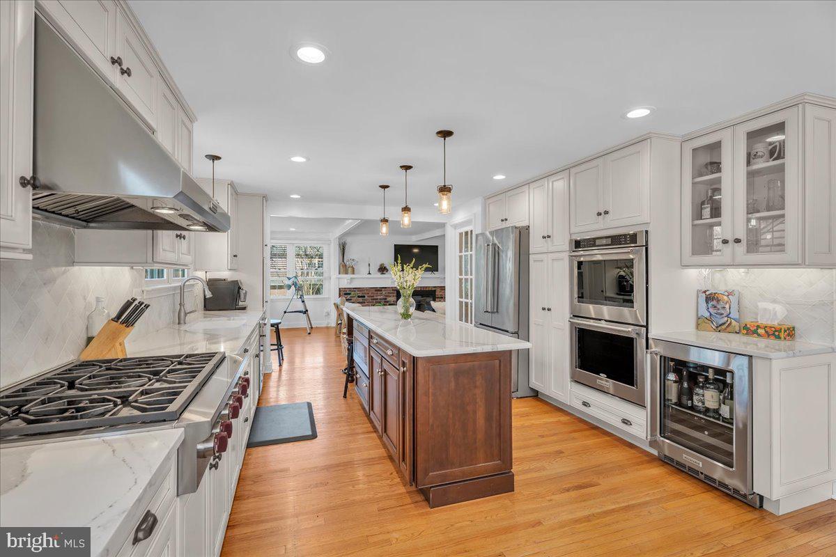 126 Ashford Road Cherry Hill, NJ 08003 - Photo 11 of 43 a kitchen with stainless steel appliances granite countertop a stove and a refrigerator