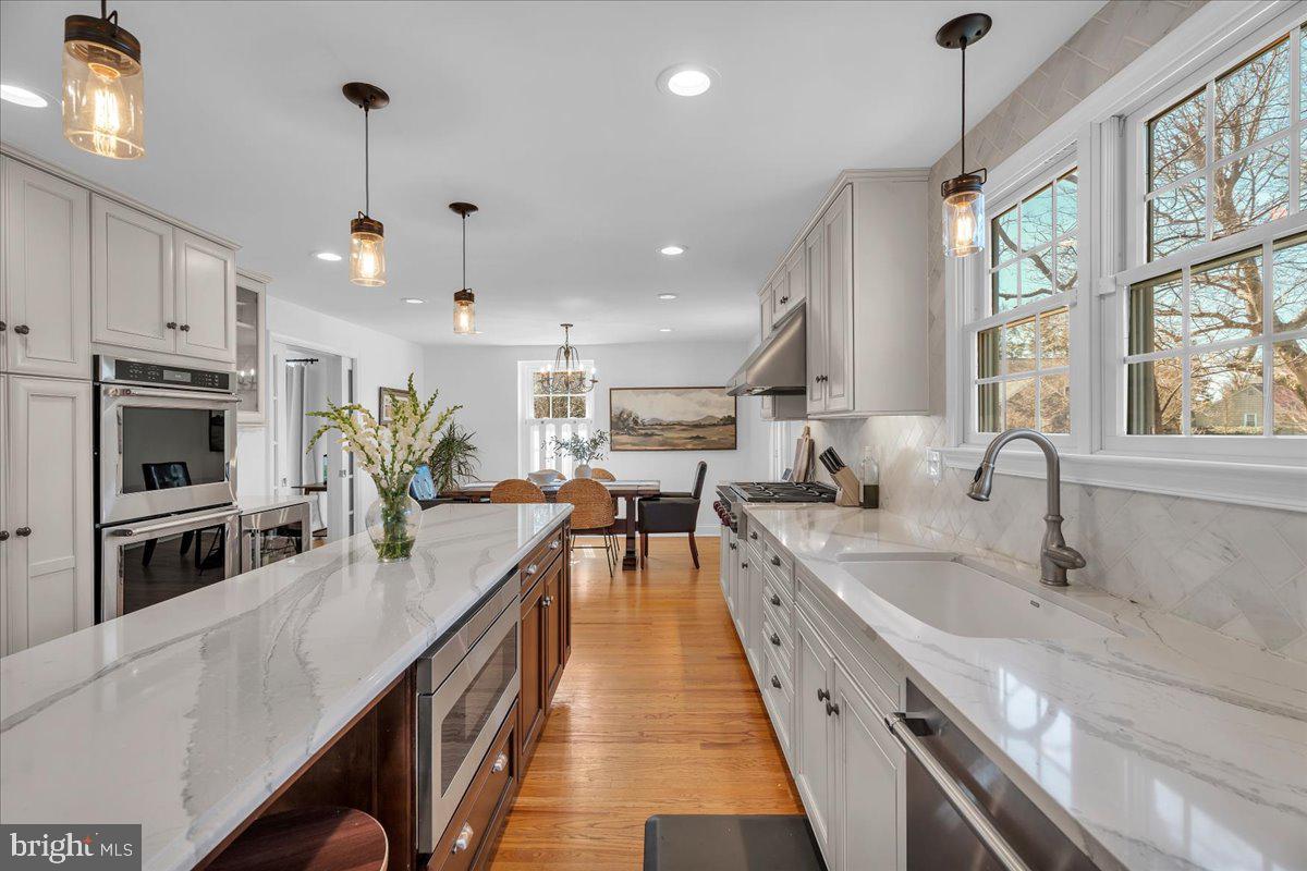 126 Ashford Road Cherry Hill, NJ 08003 - Photo 12 of 43 a large kitchen with stainless steel appliances lots of counter space and a sink