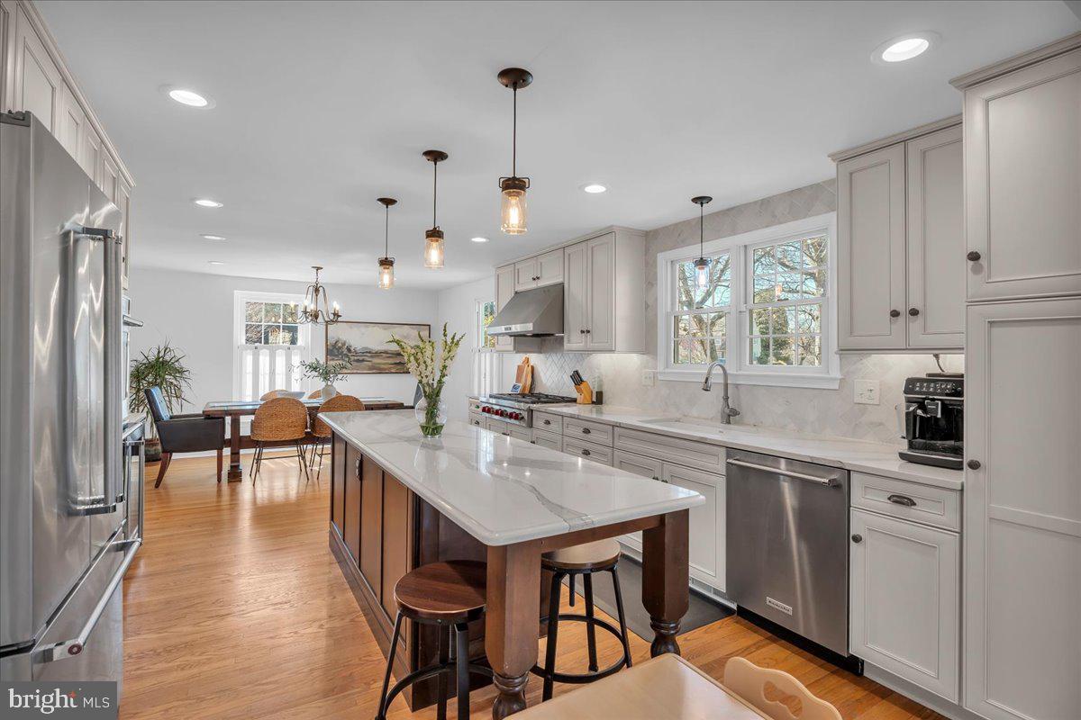 126 Ashford Road Cherry Hill, NJ 08003 - Photo 14 of 43 a kitchen with counter space dining table and chairs