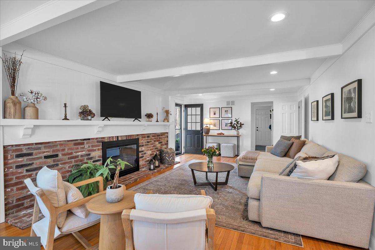 126 Ashford Road Cherry Hill, NJ 08003 - Photo 16 of 43 a living room with furniture a flat screen tv and a fireplace