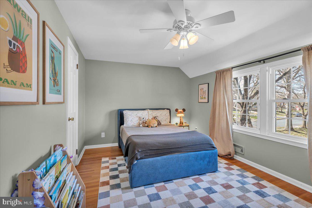 126 Ashford Road Cherry Hill, NJ 08003 - Photo 23 of 43 a bedroom with a bed and a chandelier