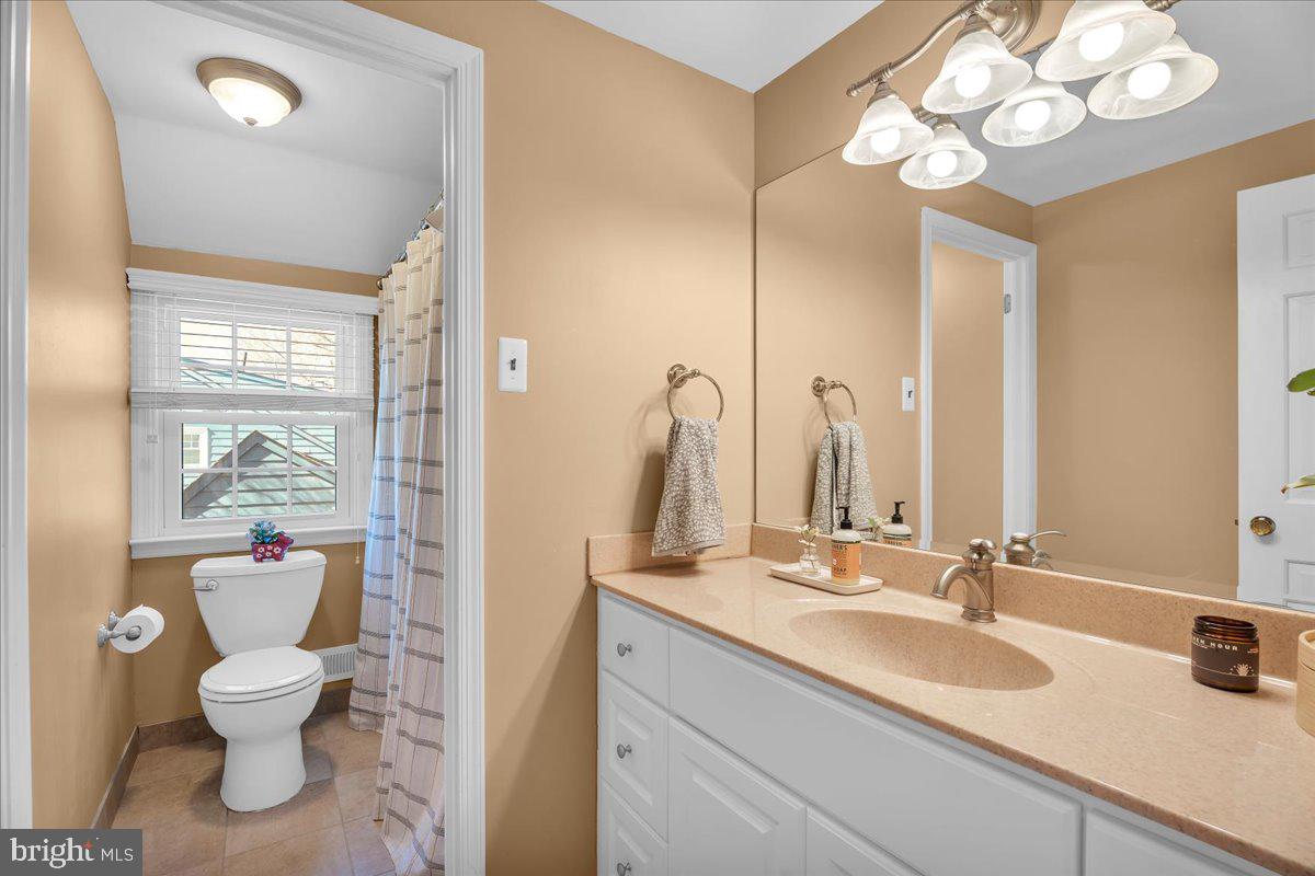 126 Ashford Road Cherry Hill, NJ 08003 - Photo 24 of 43 a bathroom with a toilet sink and mirror