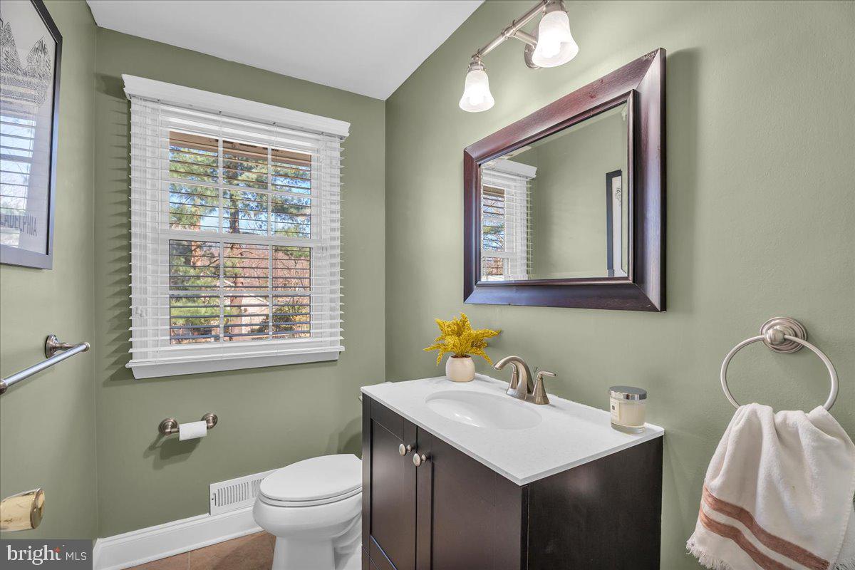 126 Ashford Road Cherry Hill, NJ 08003 - Photo 27 of 43 a bathroom with a toilet sink and mirror