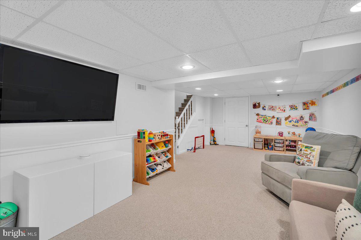 126 Ashford Road Cherry Hill, NJ 08003 - Photo 30 of 43 a living room with furniture and a flat screen tv