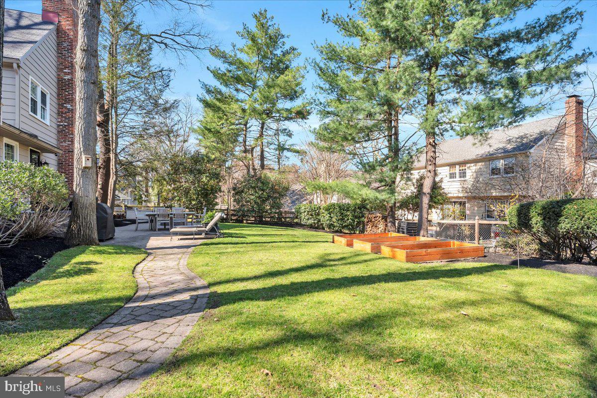 126 Ashford Road Cherry Hill, NJ 08003 - Photo 36 of 43 a view of a swimming pool with a bench in front of house