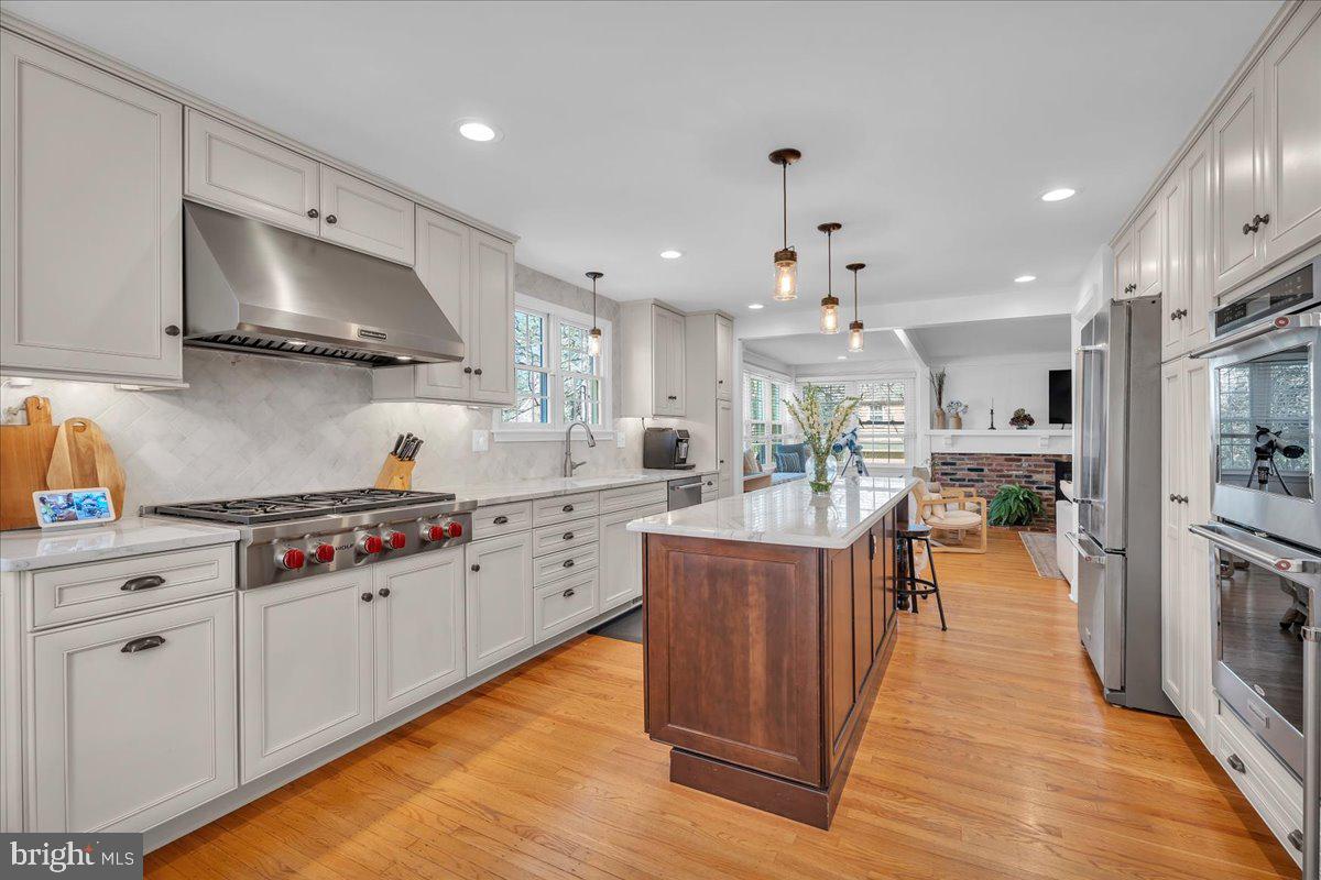126 Ashford Road Cherry Hill, NJ 08003 - Photo 10 of 43 a kitchen with stainless steel appliances granite countertop a stove oven and a refrigerator
