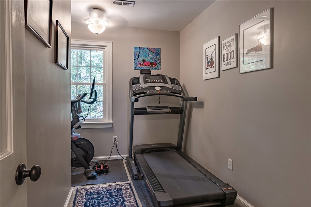 620 Seminole Point Road Fair Play, SC 29643 - Photo 30 of 50 Natural light streams through a classic multi-lite window into this versatile home gym space that has a walk-up staircase to the floored attic space