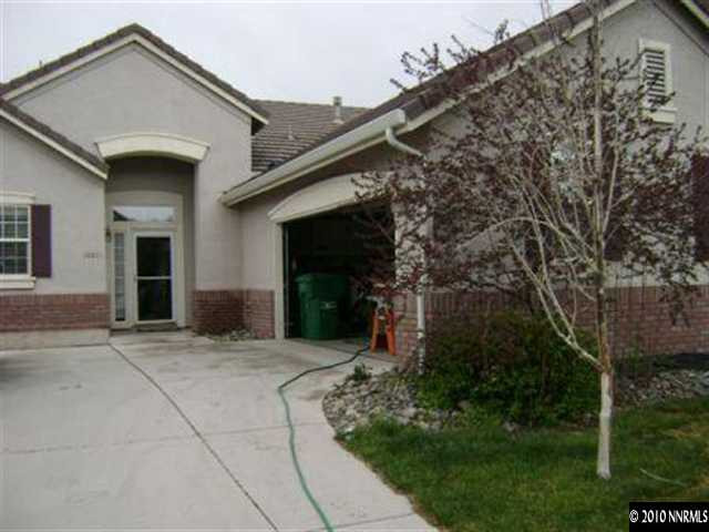 10211 Wolf Ridge Way Reno, NV 89521 - Photo 1 of 4 front view of house with a yard