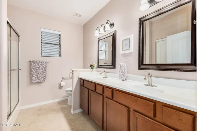 a bathroom with a shower and a sink