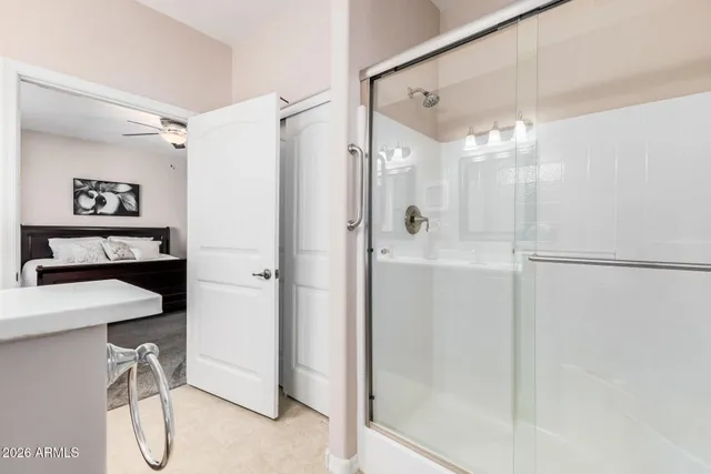 a view of walk in closet with clothes