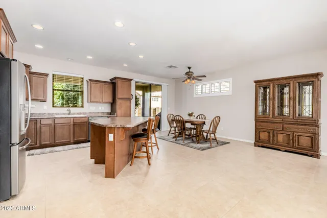 a kitchen with sink refrigerator and window