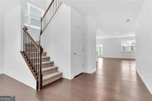 a view of entryway with wooden floor