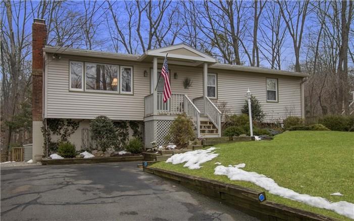 284 Great Hill Road Ridgefield, CT 06877 - Photo 1 of 1 a front view of a house with a yard