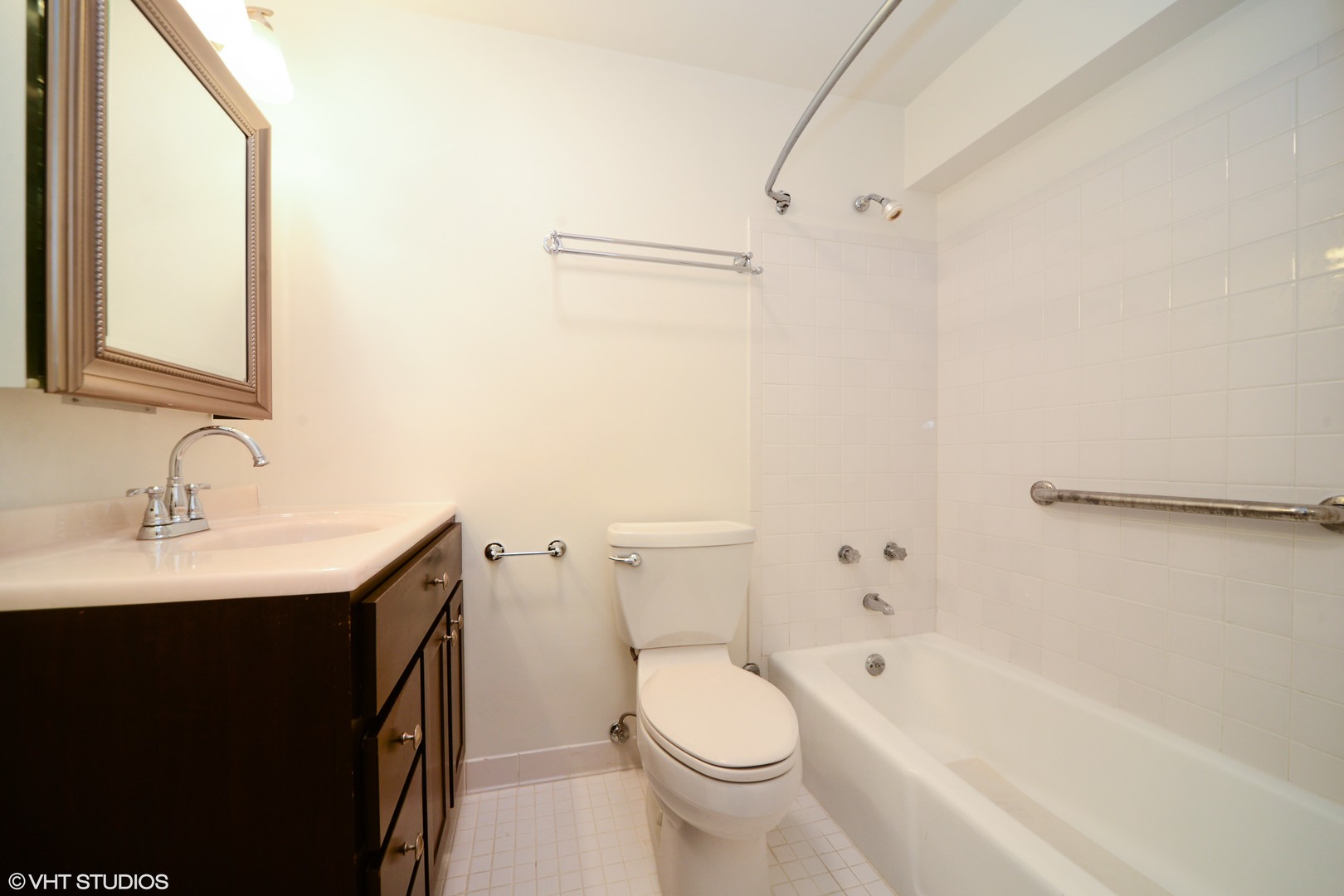 5455 North Sheridan Road, Unit 2810 Chicago, IL 60640 - Photo 8 of 9 a bathroom with a sink a toilet and shower