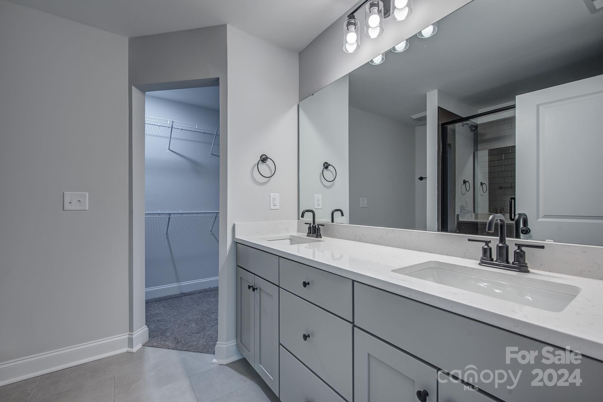 525 Blacksnake Road Stanley, NC 28164 - Photo 14 of 21 a bathroom with a sink double vanity and a mirror
