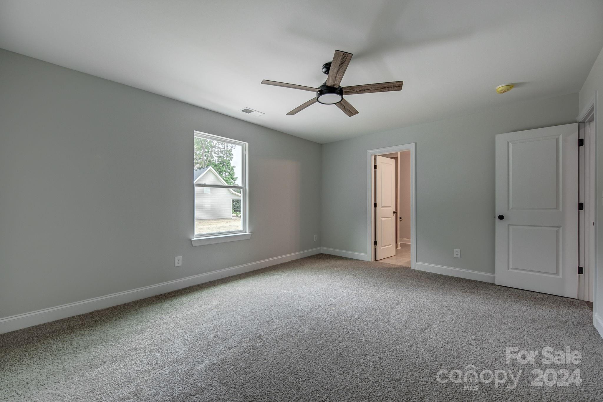 525 Blacksnake Road Stanley, NC 28164 - Photo 16 of 21 a view of empty room with windows