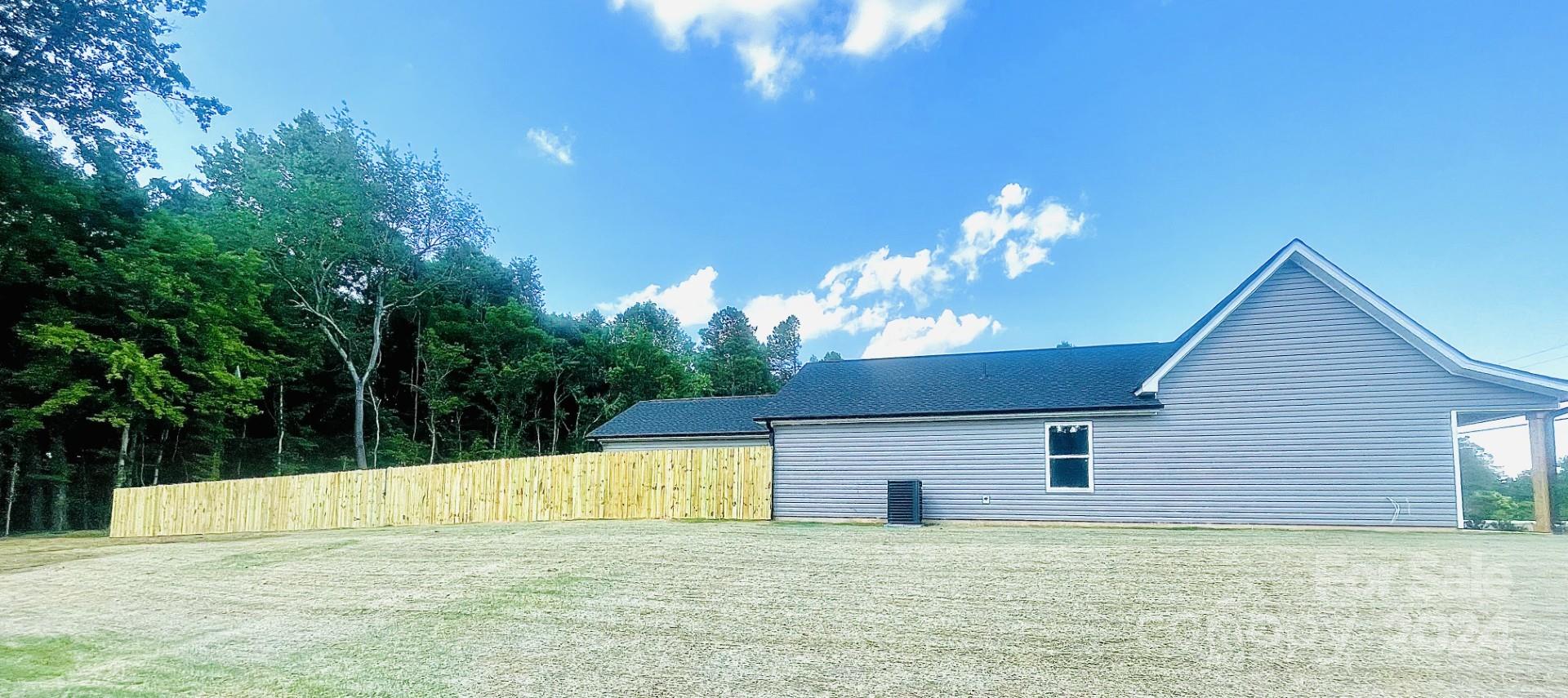 525 Blacksnake Road Stanley, NC 28164 - Photo 3 of 21 a view of a house with a backyard