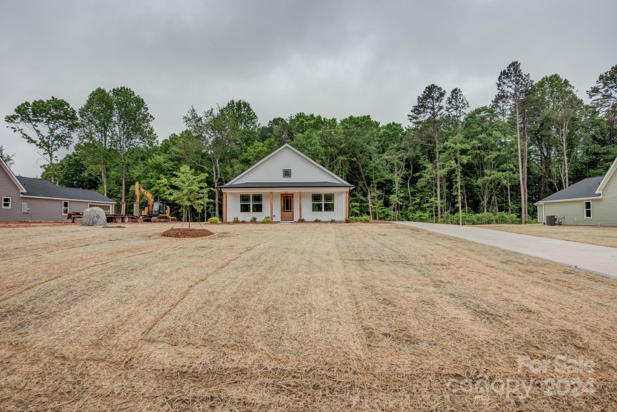 525 Blacksnake Road Stanley, NC 28164 - Photo 5 of 21 a front view of a house with a yard and trees