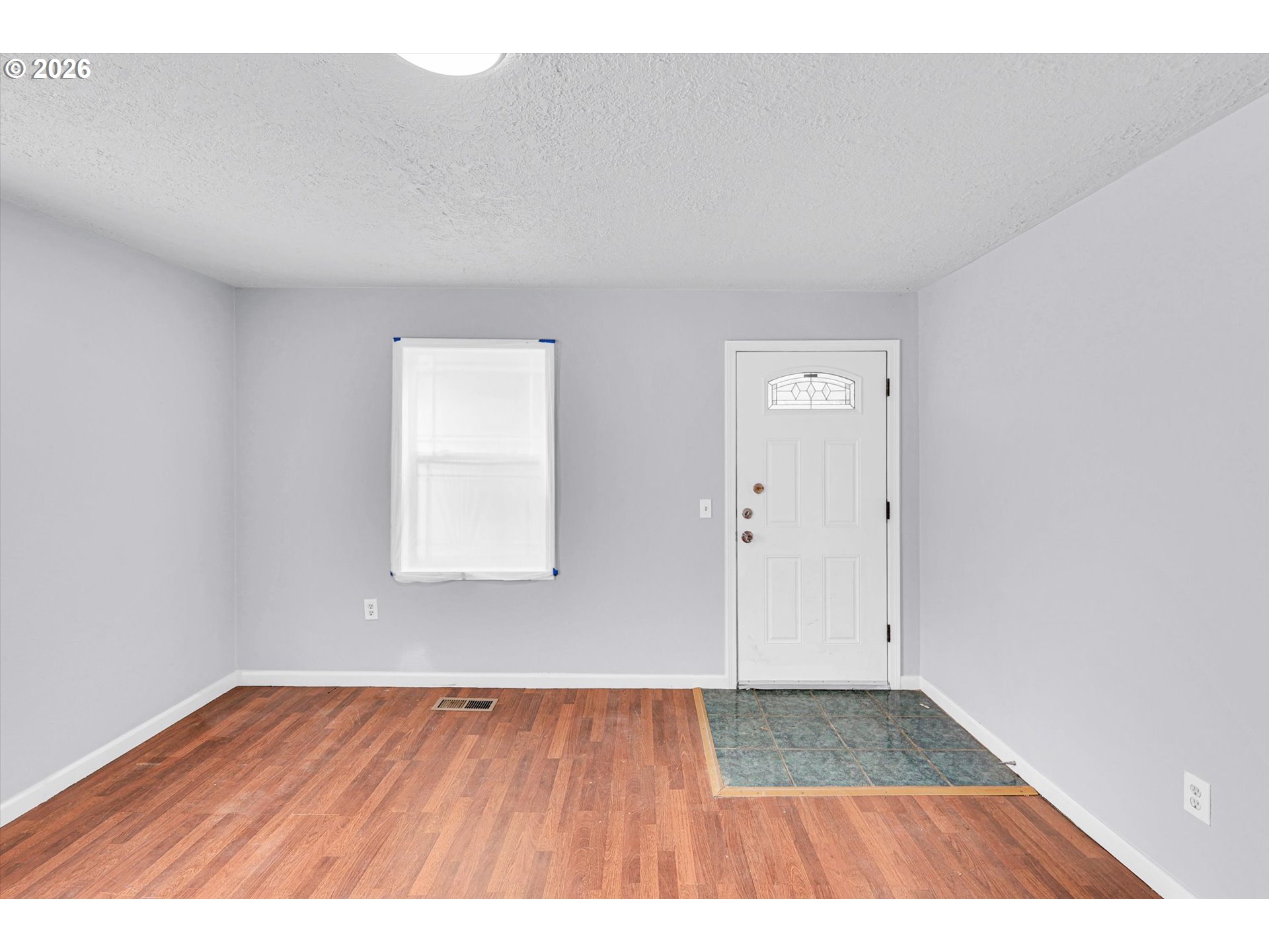 14125 Southeast Division Street Portland, OR 97233 - Photo 14 of 17 a view of an empty room and wooden floor
