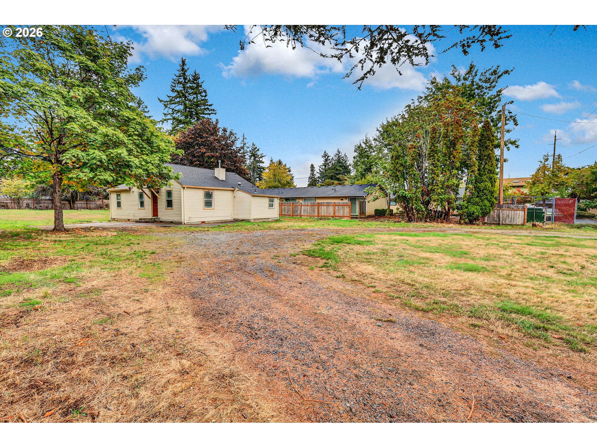 14125 Southeast Division Street Portland, OR 97233 - Photo 2 of 17 a view of a yard with an trees