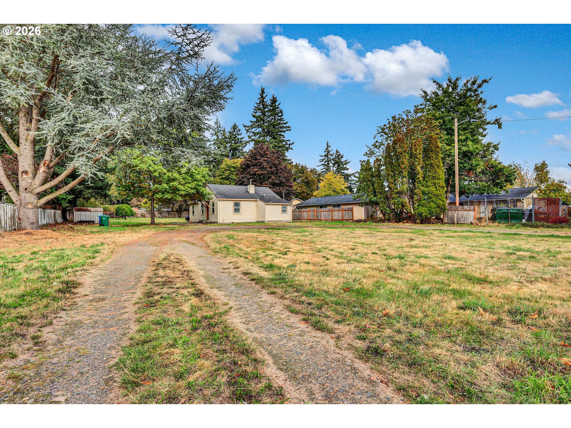 14125 Southeast Division Street Portland, OR 97233 - Photo 4 of 17 a view of swimming pool with yard and trees in the background