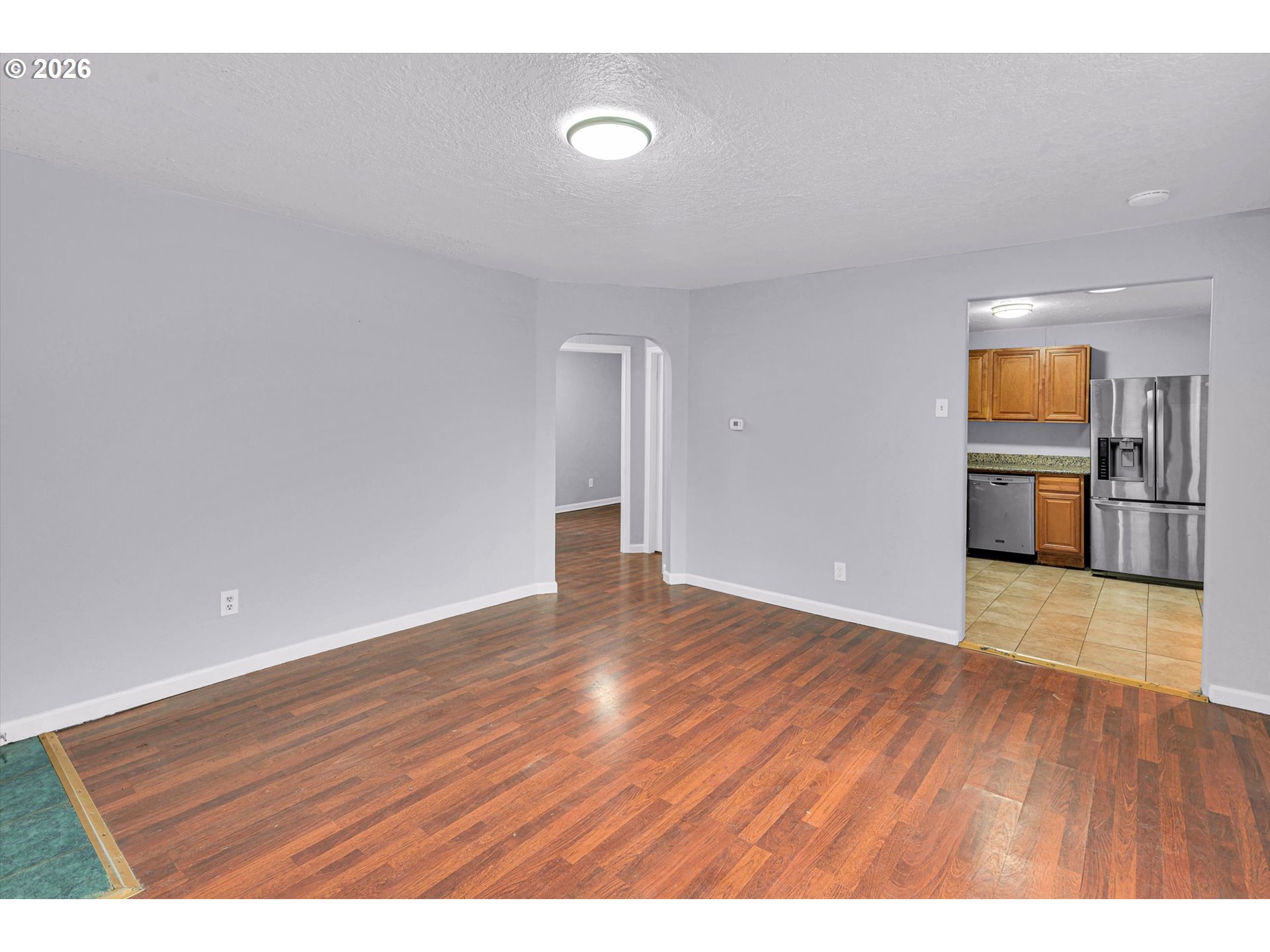 14125 Southeast Division Street Portland, OR 97233 - Photo 5 of 17 a view of empty room with wooden floor