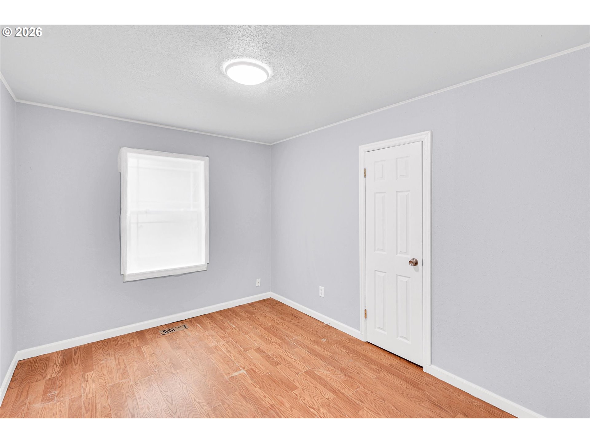 14125 Southeast Division Street Portland, OR 97233 - Photo 9 of 17 a view of an empty room with a window
